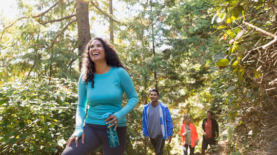 family hiking in the woods