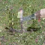 Spade pushed into the ground to make a slit