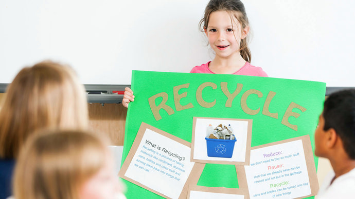 Schoolgirl giving a presentation on recycling