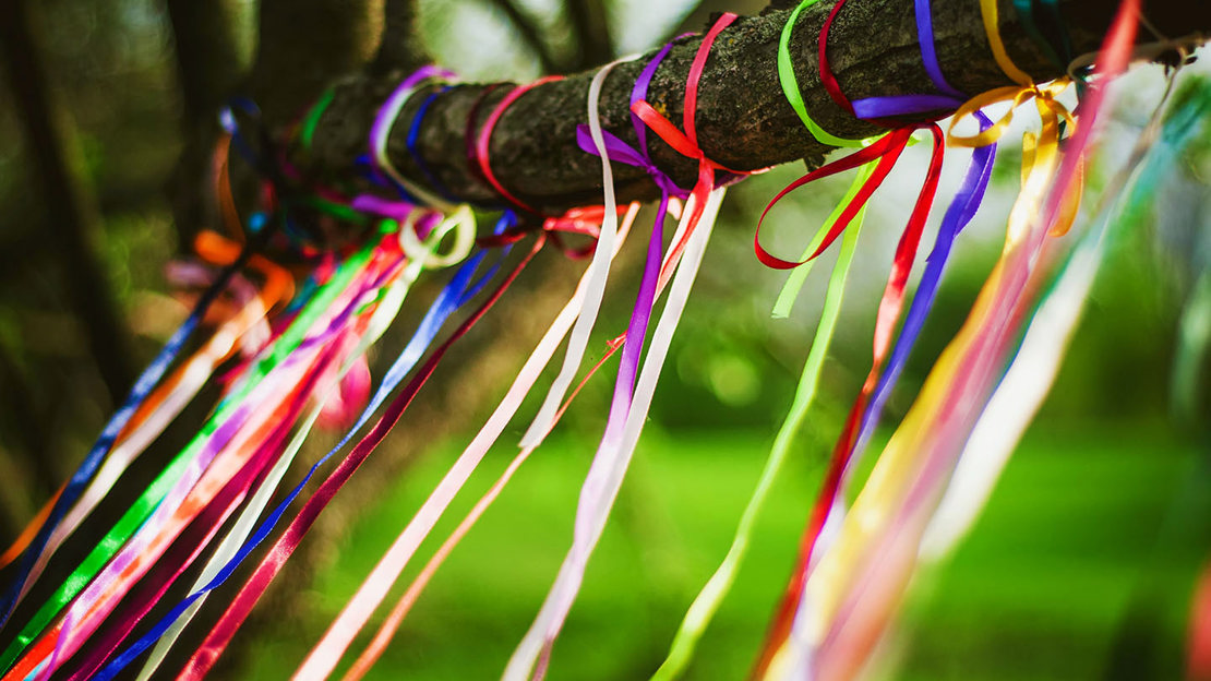 Colourful ribbons tied to a branch