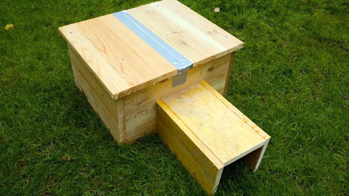 Homemade hedgehog house on grass