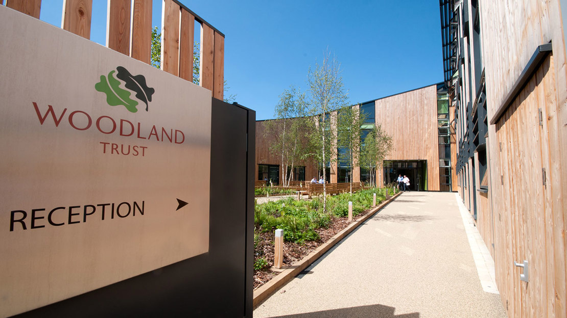 Pathway with sign leading to the Woodland Trust reception