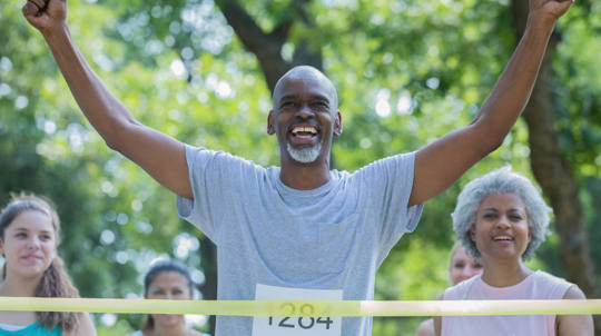 Man crossing a race finish line