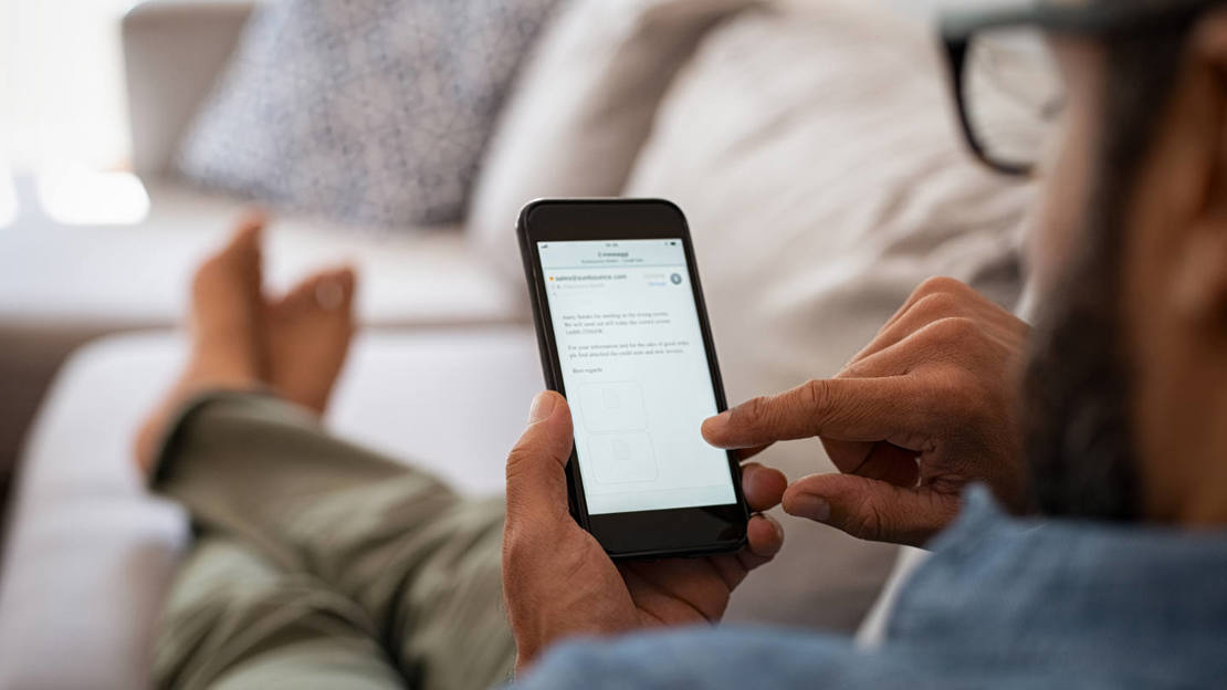 Man scrolling through his phone