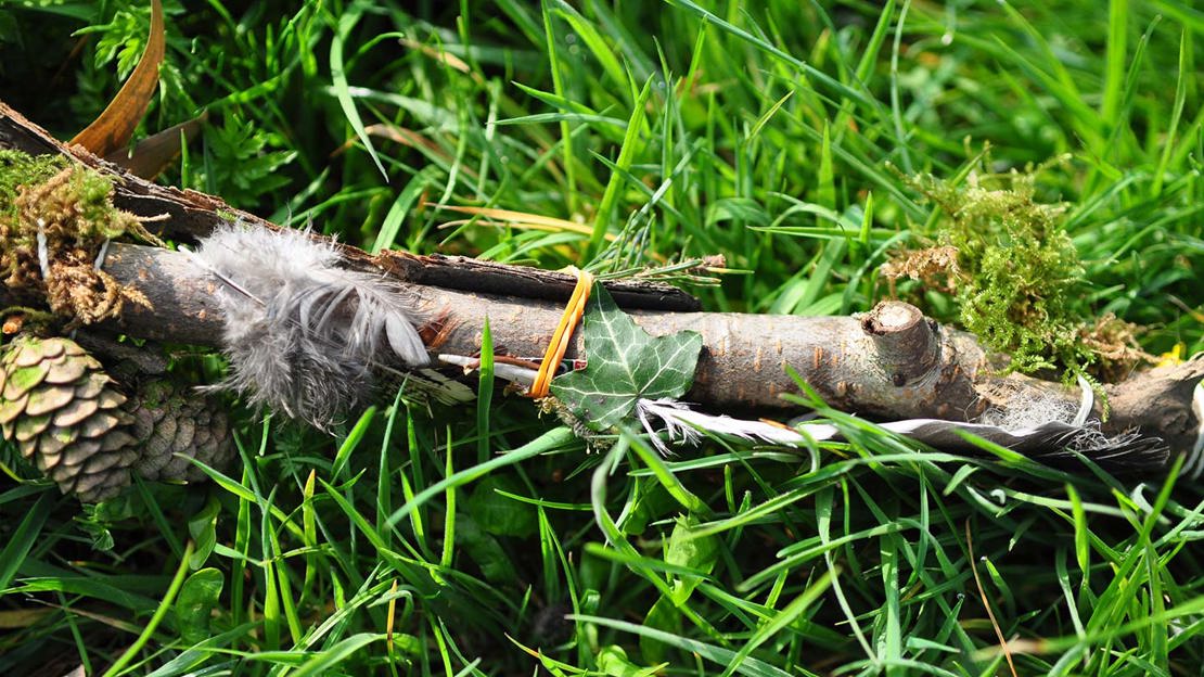 Journey stick covered in natural materials