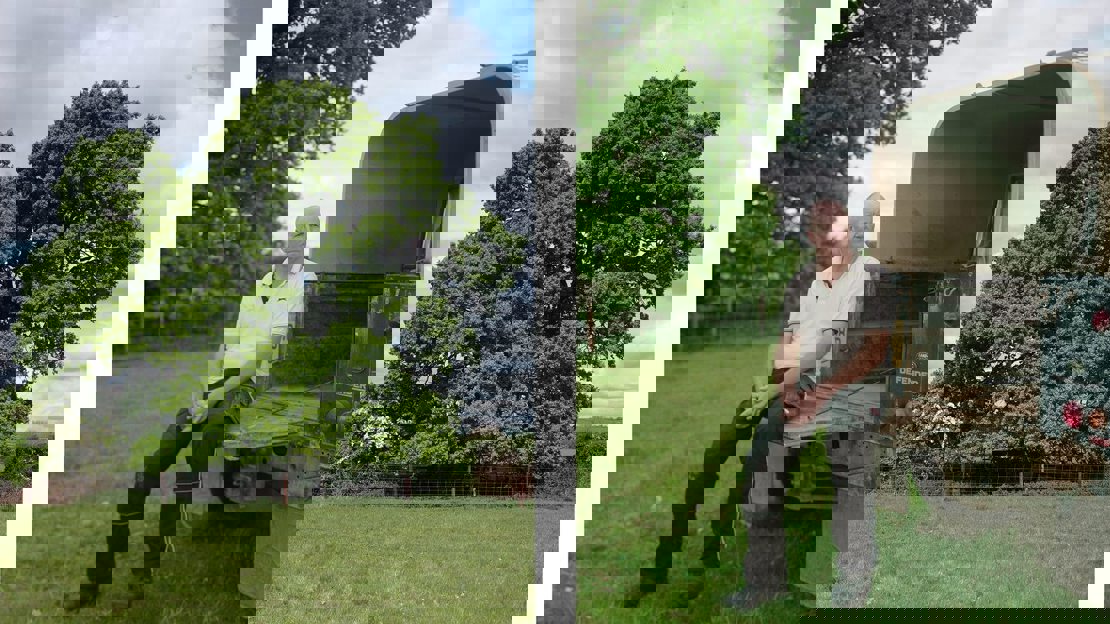 Outdoor profile shot of Andrew Brown and a close up of an ancient tree