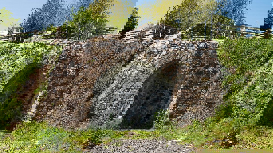 A brick kiln set into a grassy mound