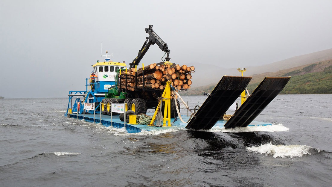 Woodland Trust barge on Loch Arkaig on misty day.