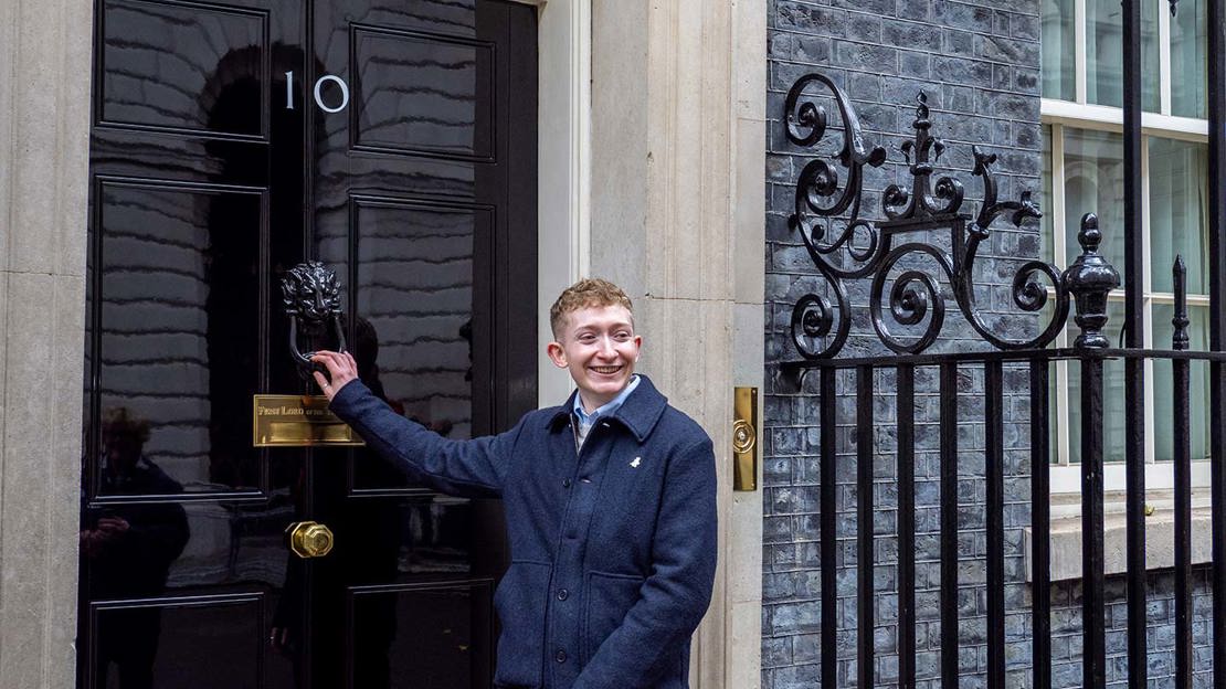 Charlie Knowles from the youth council at the door of 10 Downing Street
